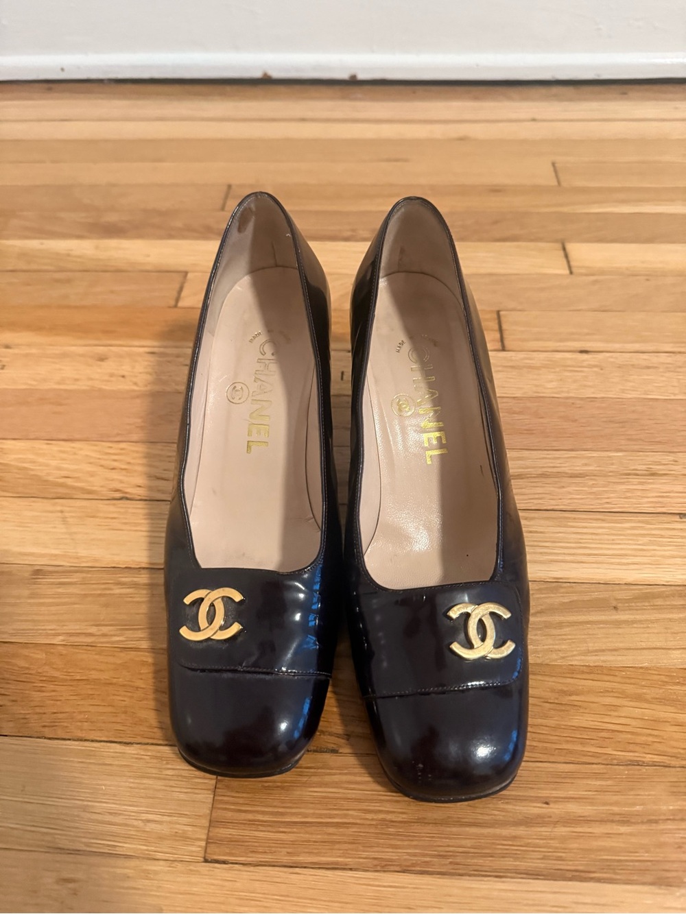 CHANEL Black Patent Leather Pumps with Gold CC Medallion